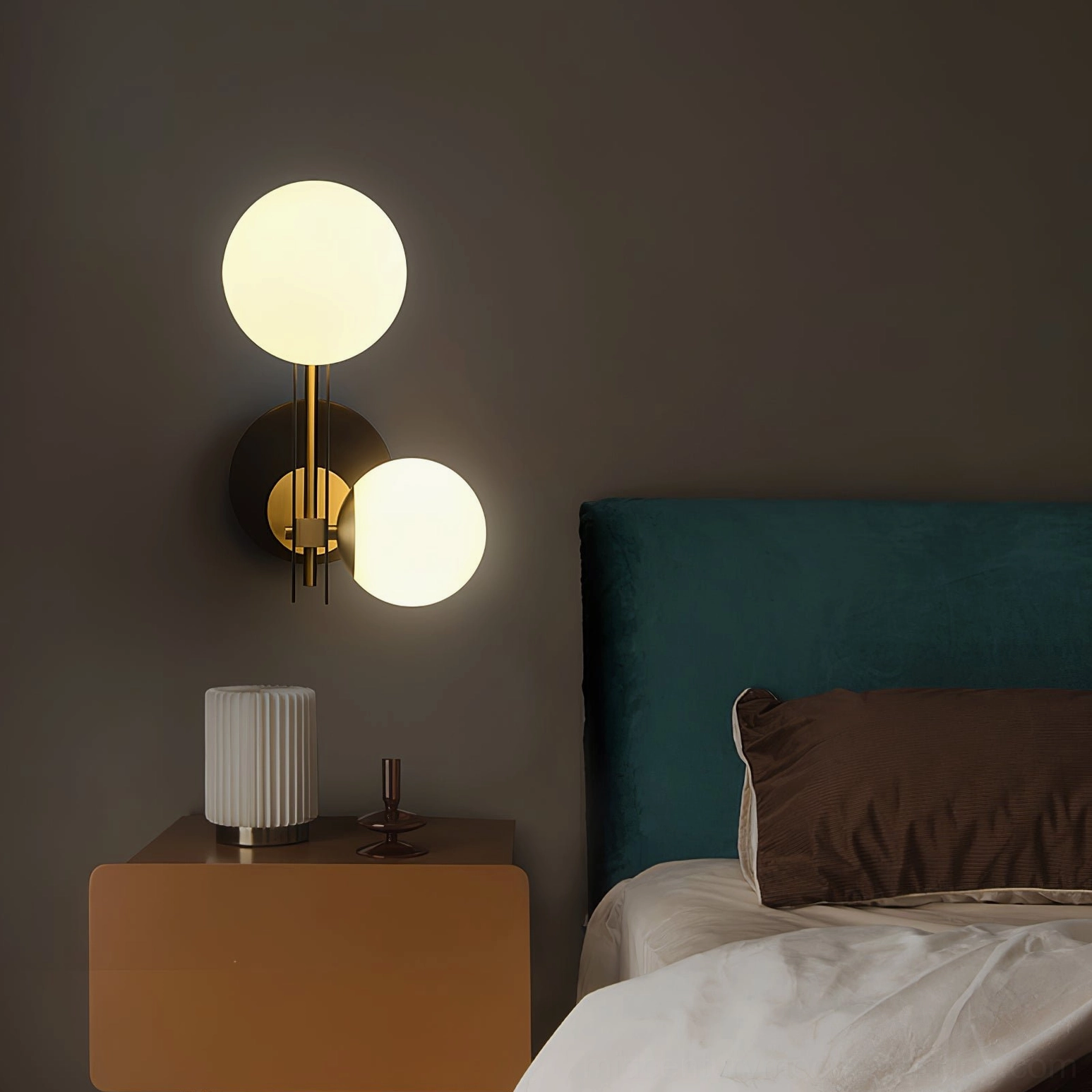 Planeta frosted glass globe wall lamp showing warm light diffusion and modern brass accents