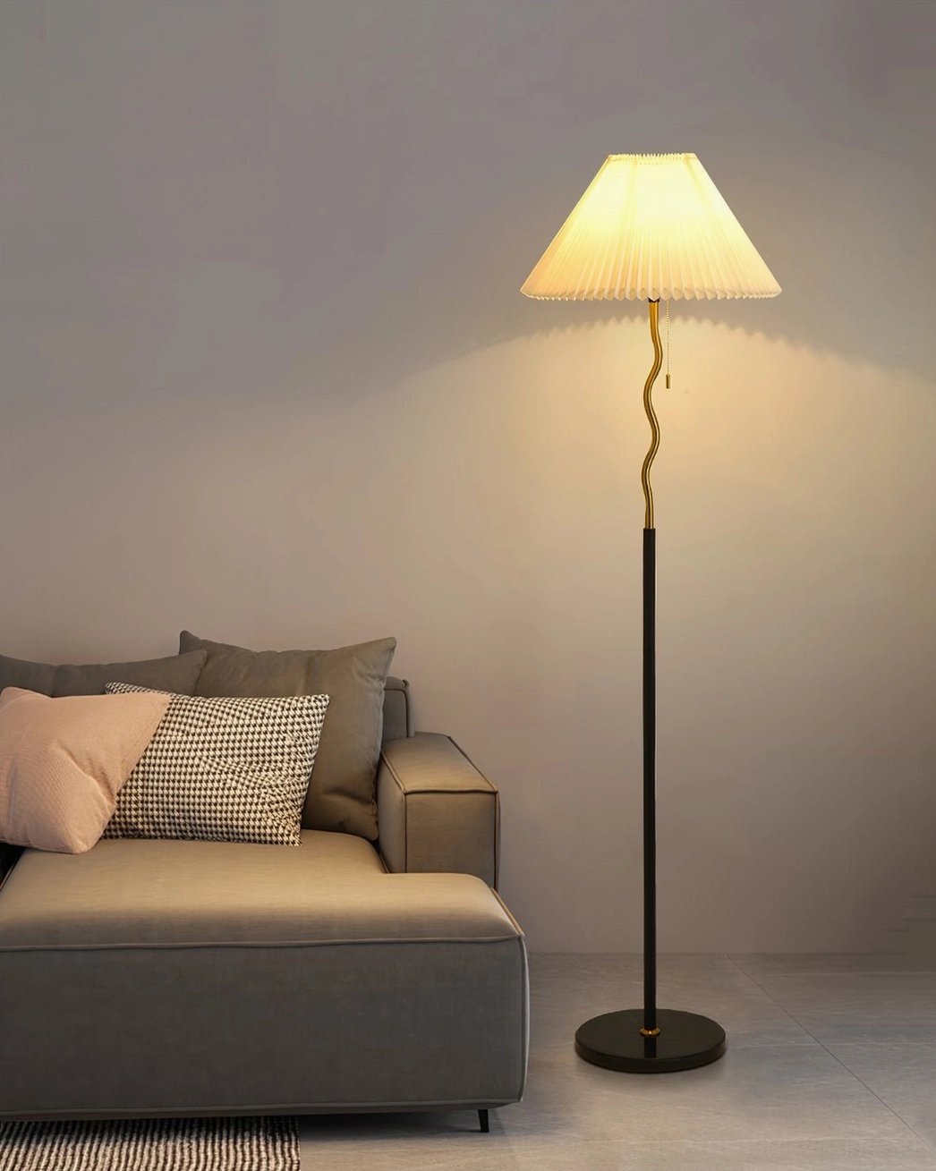 Pleated floor lamp installed in styled interior showing scale and ambient lighting effect