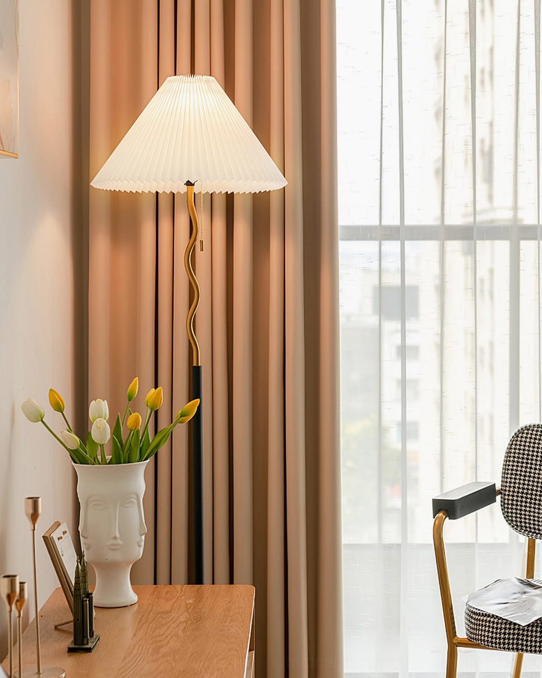 Pleated floor lamp by window with brown sheer curtains and decorative table in vintage minimalist interior