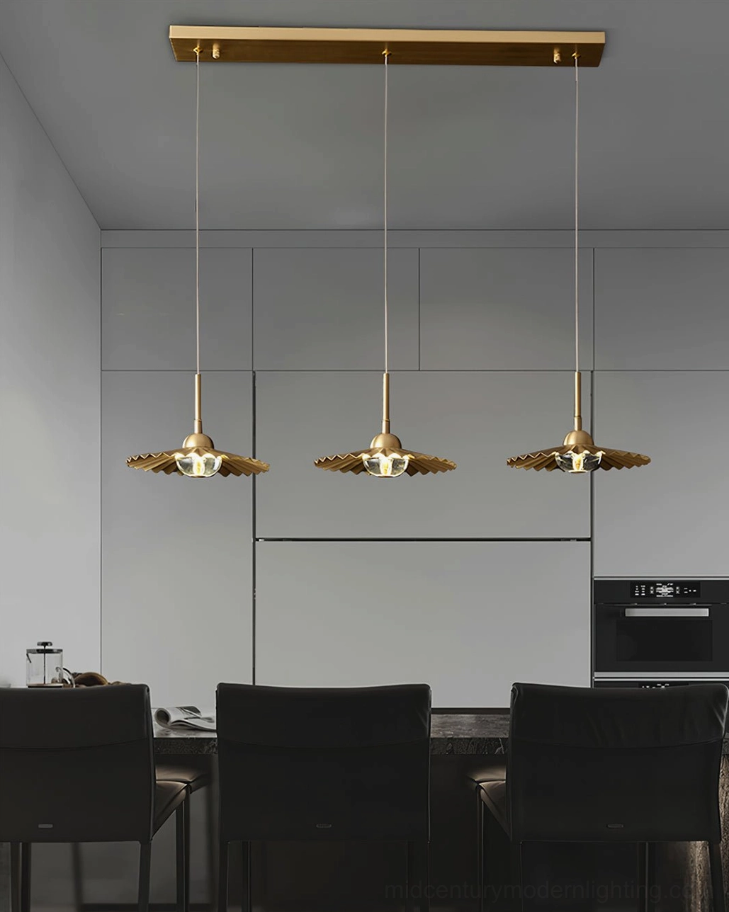 Plié mid-century modern pendant light fixture detail showing brass hardware and suspension mechanism