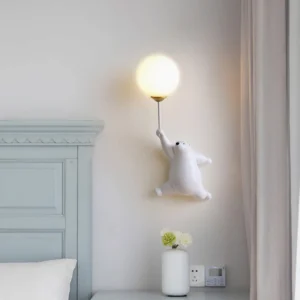 White polar bear balloon wall lamp illuminated in minimalist bedroom - soft ambient lighting on wall sconce