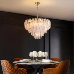 Poliedri glass chandelier hanging in luxury dark dining room with warm ambient light casting through rippled glass layers