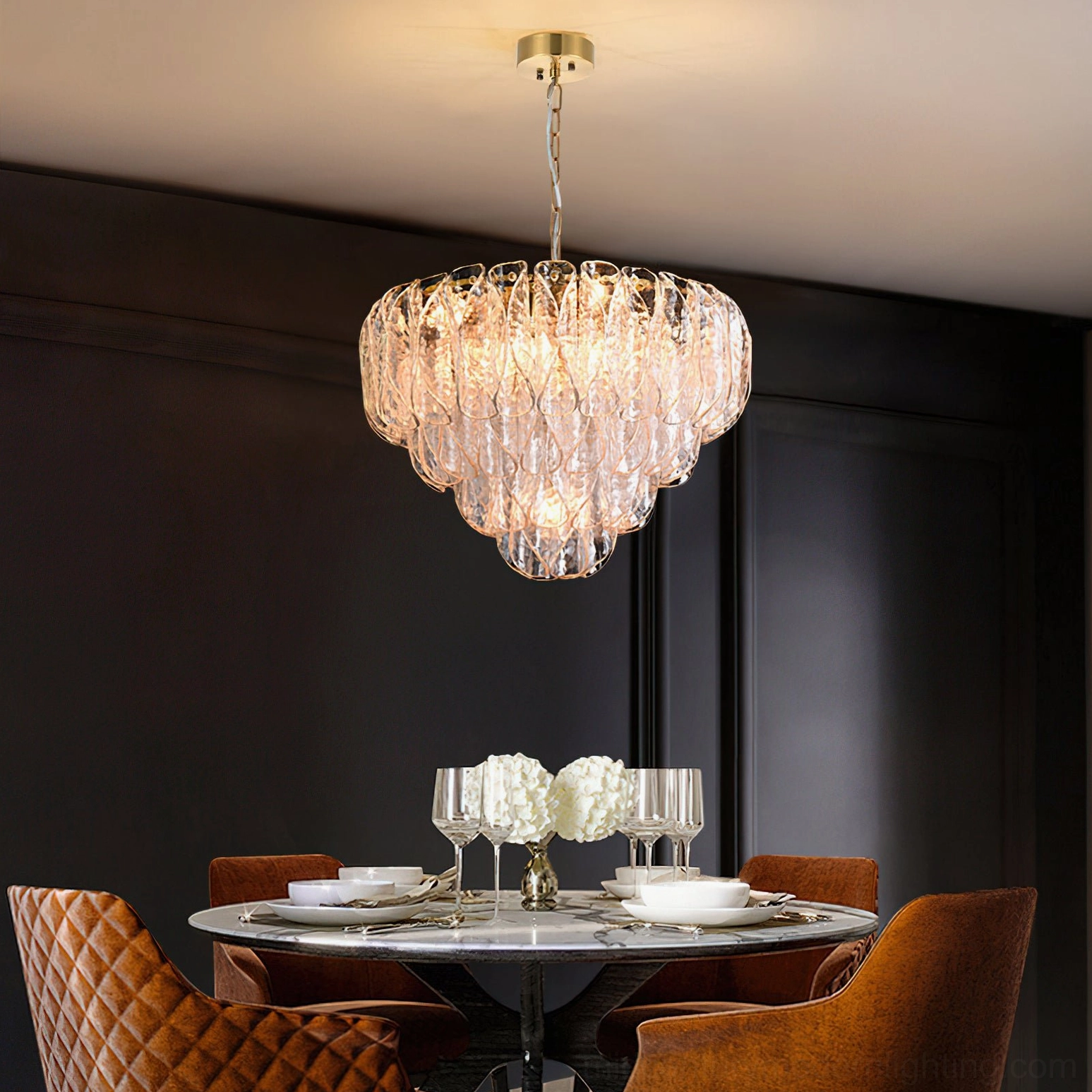 Poliedri glass chandelier hanging in luxury dark dining room with warm ambient light casting through rippled glass layers