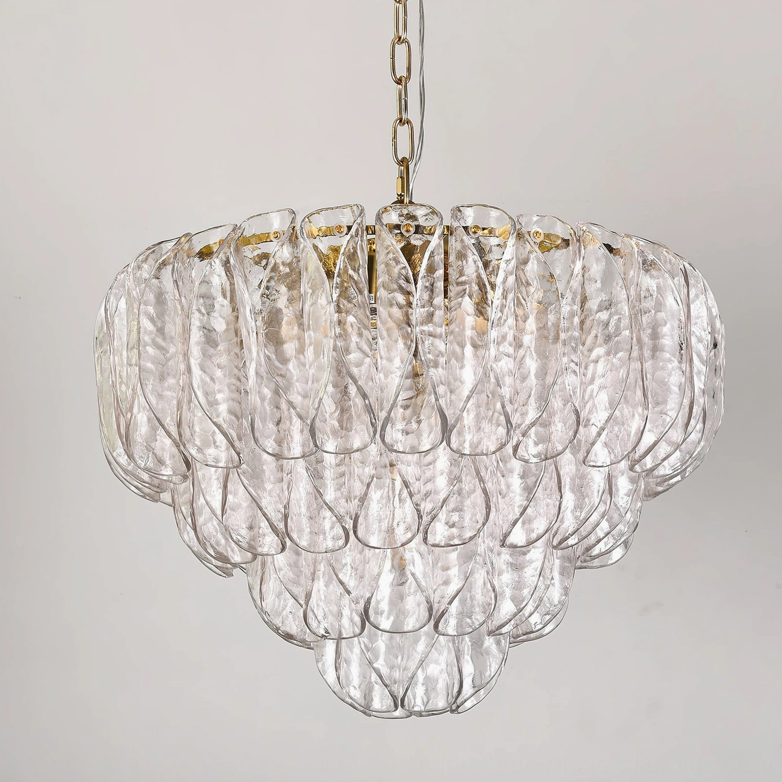 Poliedri tiered glass chandelier hanging accent view with full petal layers and brass finish detail
