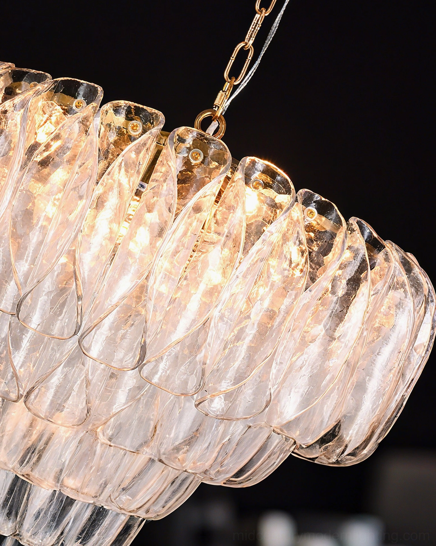Poliedri glass chandelier extreme close-up showing rippled petal texture and brass hardware craftsmanship