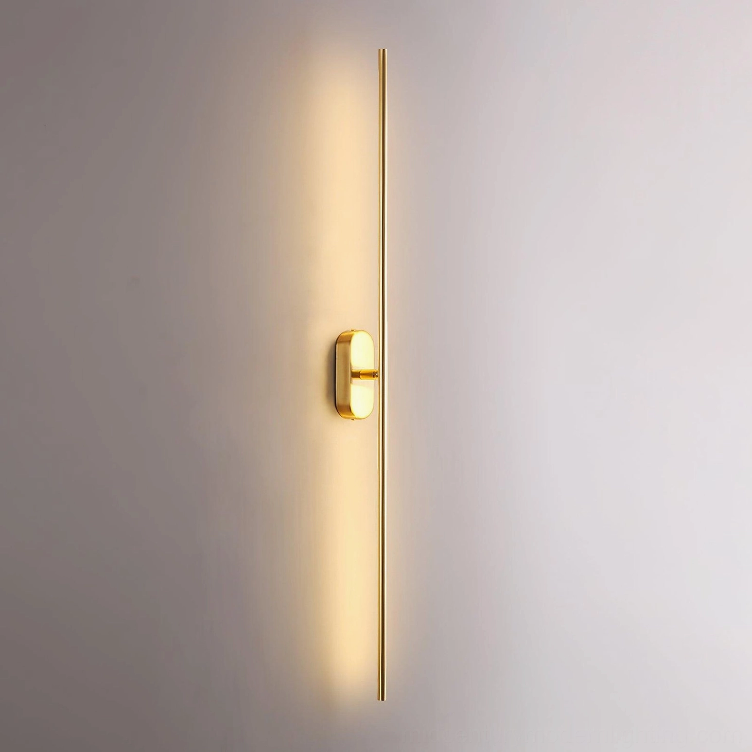 Polished brass linear sconce elegant mid-century modern design