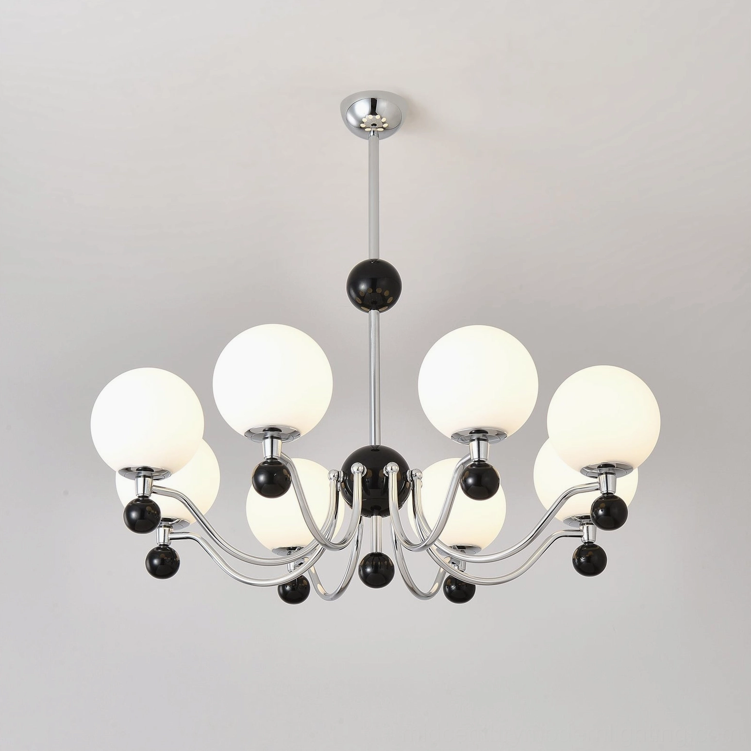 Modern geometric chandelier with polished chrome frame and decorative black spheres