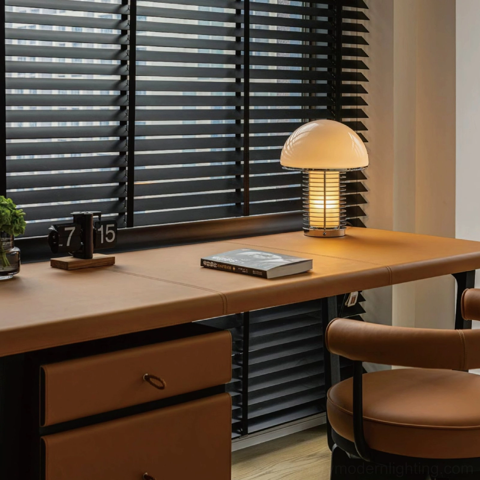 Polished chrome mushroom lamp frame reflecting light in contemporary interior setting