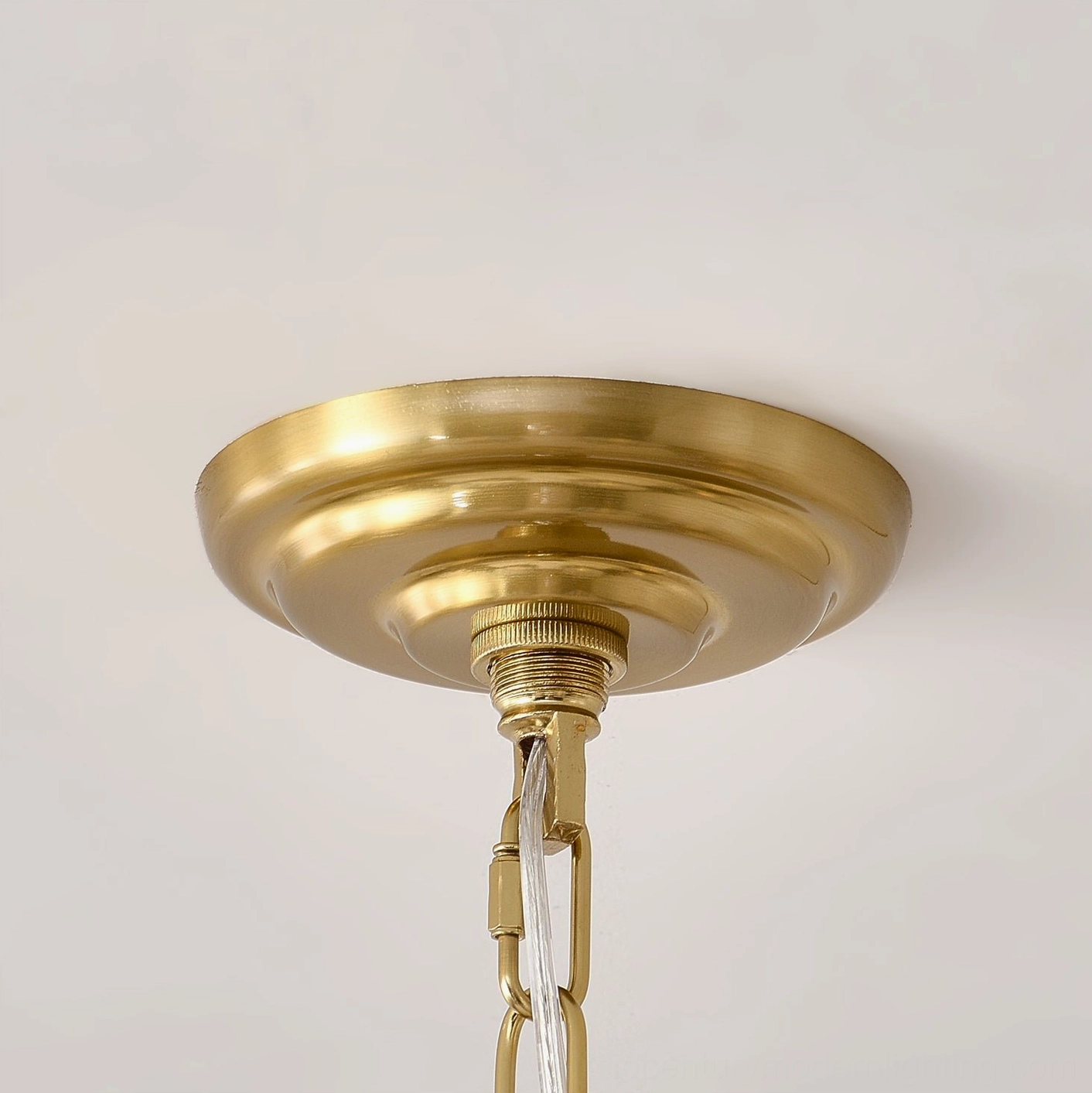 Black polka dot chandelier with luxury finishes in styled interior photography setting