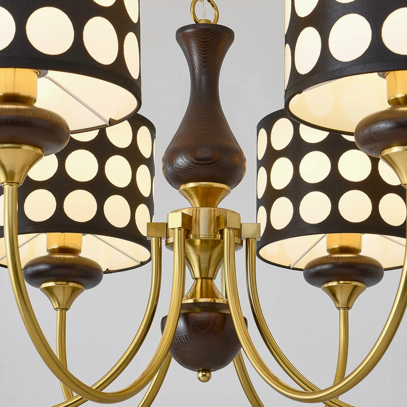 Black polka dot chandelier side profile view highlighting geometric proportions and frame design