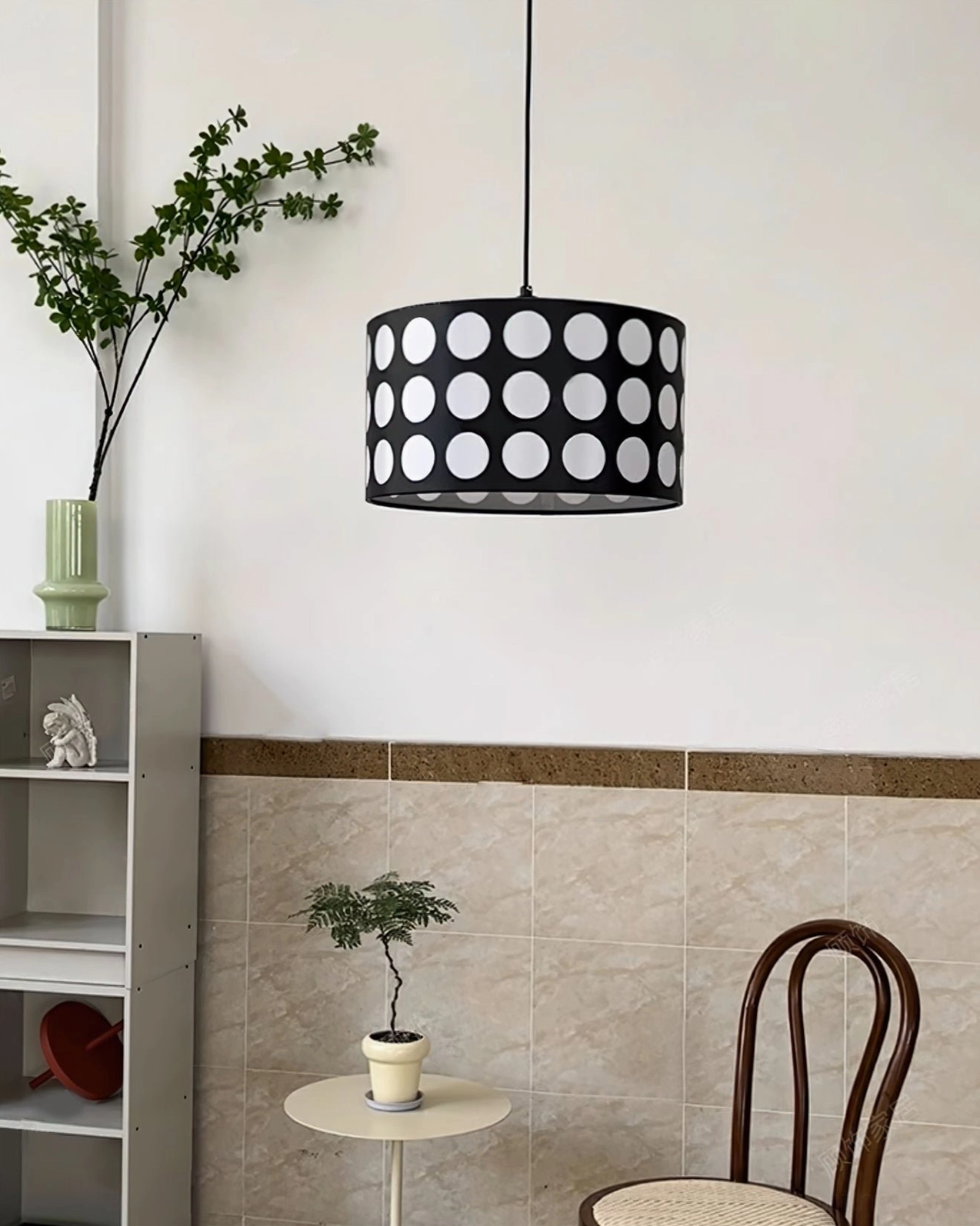 Polka dot pendant lamp installed in bedroom nook creating cozy ambient lighting atmosphere