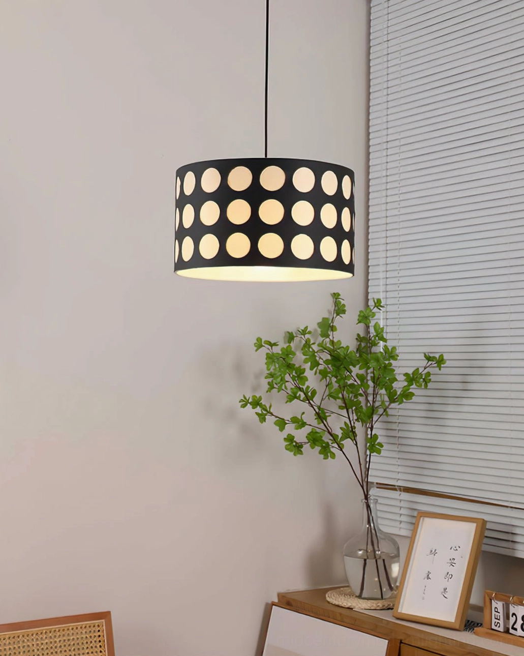 Polka dot pendant lamp detail view displaying fabric material and geometric dot pattern closeup
