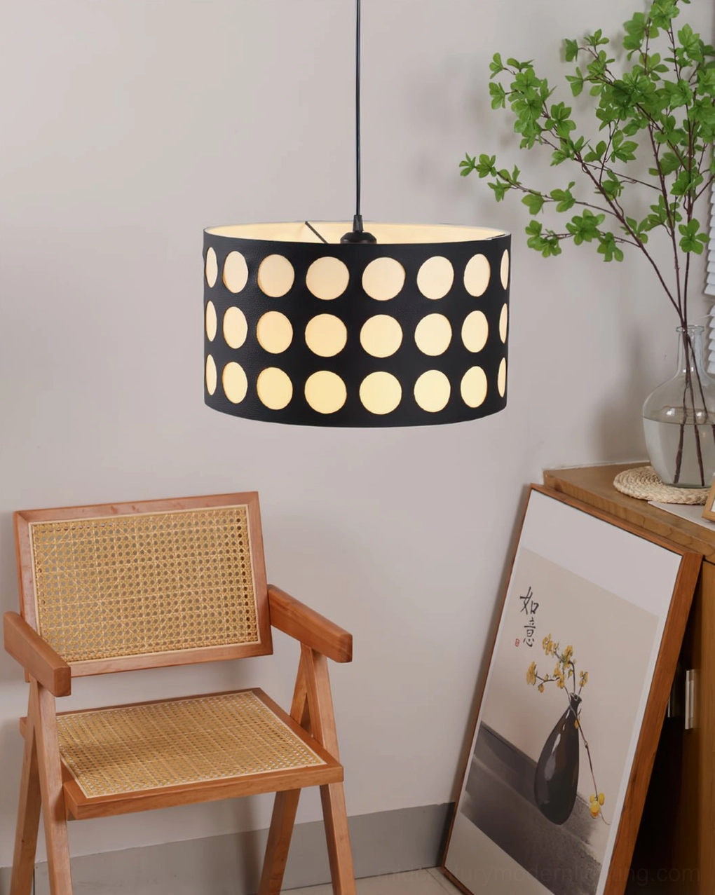 Polka dot pendant lamp in home gallery corner with rattan chair, green plants and decorative artworks