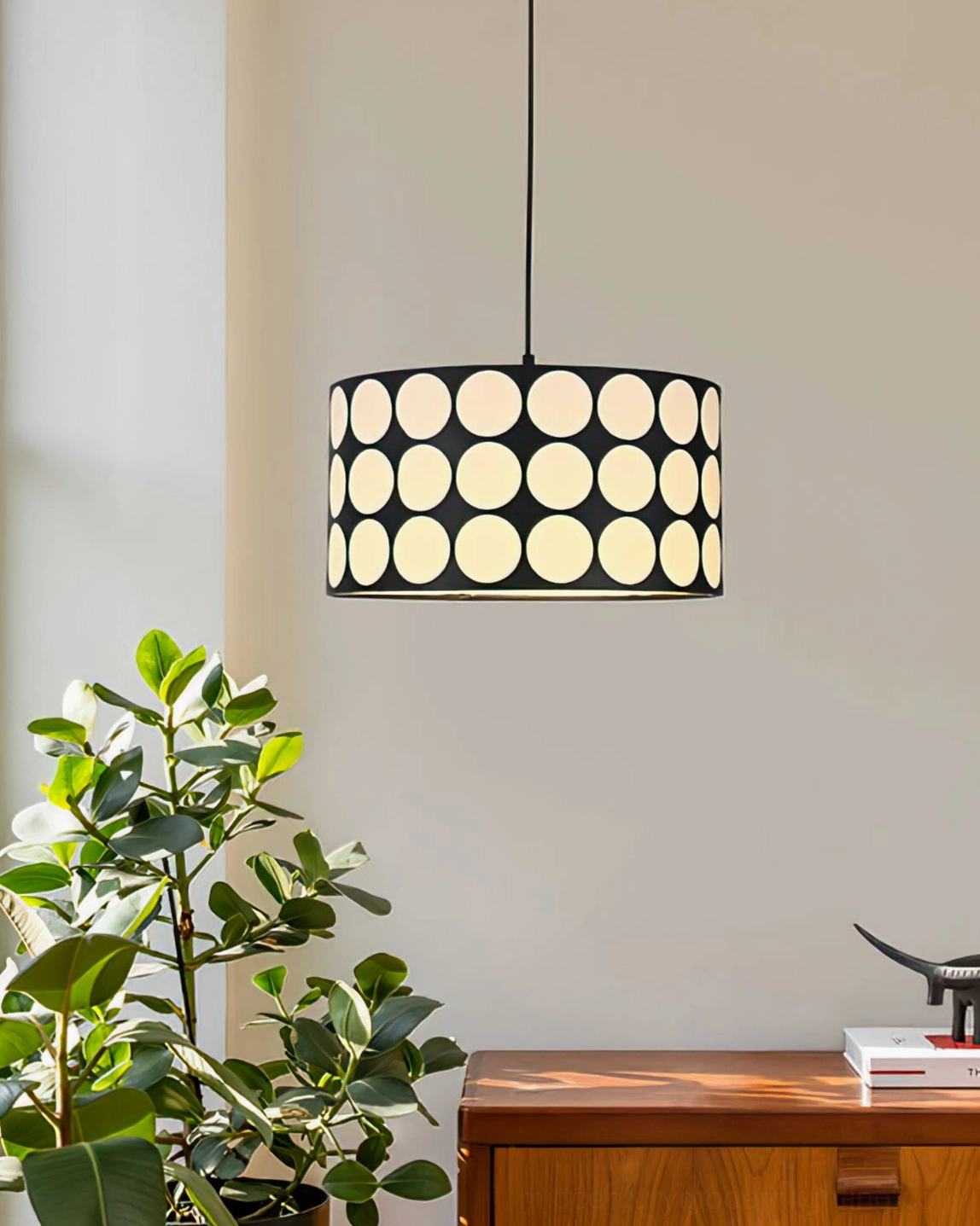 Black and white polka dot pendant lamp showing full hanging view with ceiling mount and cord