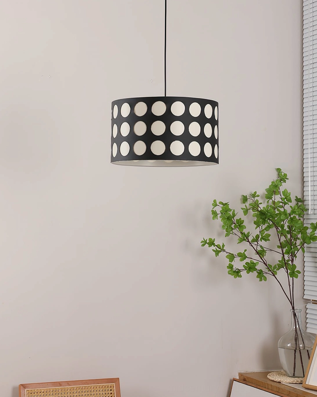 Polka dot pendant lamp overhead frontal view highlighting black frame and white circular dot design