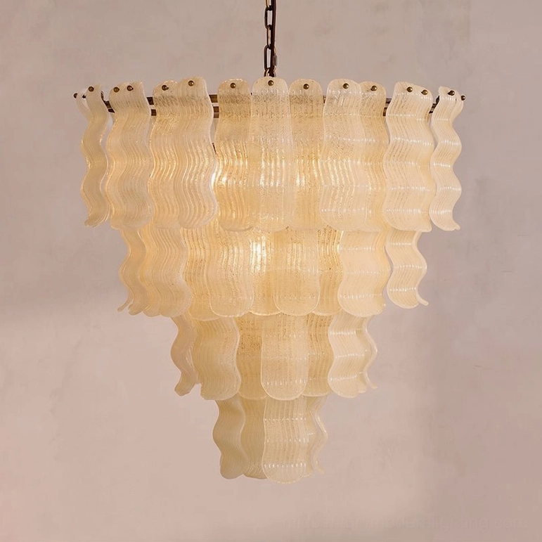 Close-up detail of Pollensa chandelier layered glass ribbons with graniglia texture and warm amber-beige tone