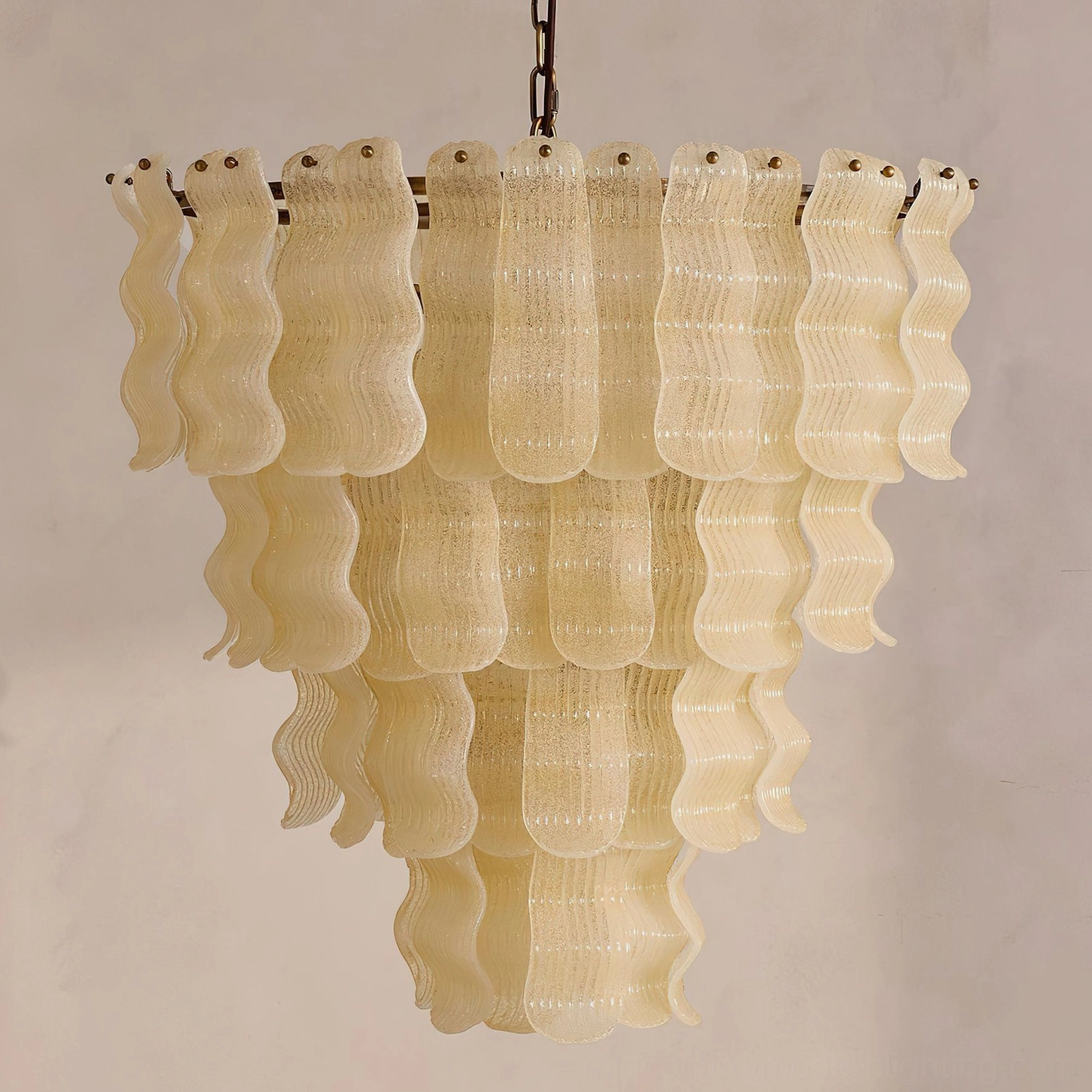 Top-down view of Pollensa textured wave chandelier highlighting thick off-white wavy glass tiers and cascading structure