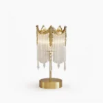 Popity crystal table lamp with brushed brass gold base and clear glass pendant details, studio product shot