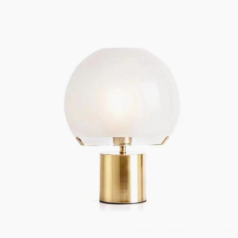 Porcino Orb Table Lamp with gold metal base and frosted white glass sphere, front studio view