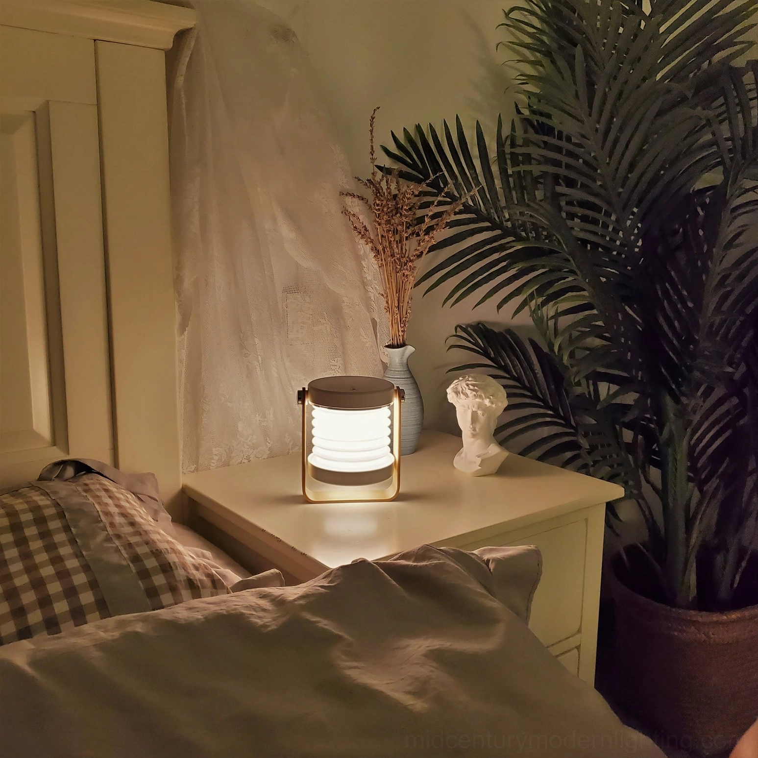 Portable lantern lamp showcasing integrated LED warm glow, Nordic design elements in minimalist interior