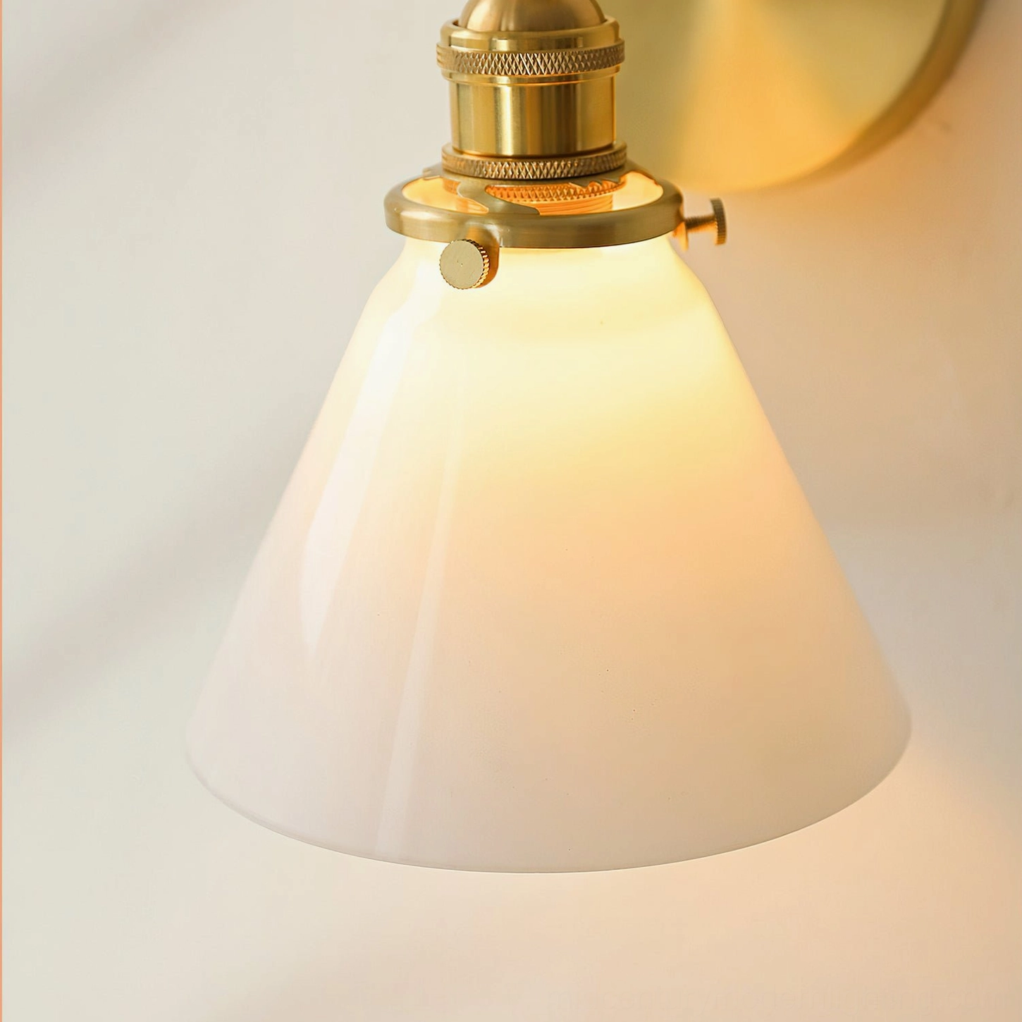 Portland mid-century swivel wall sconce installed indoors showing functional positioning and warm ambient lighting