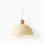 Posa mid-century modern pendant lamp with cream dome and brass sphere - front studio view