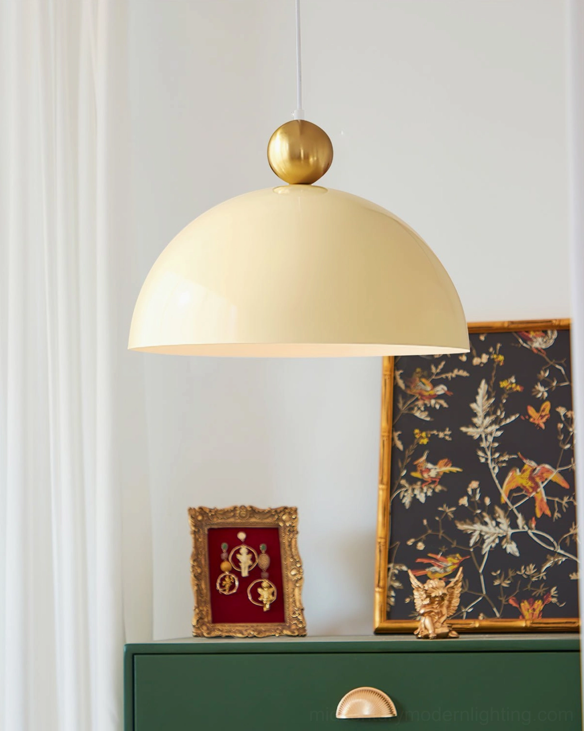 Cream white minimalist dome pendant lamp in modern home entryway with artwork
