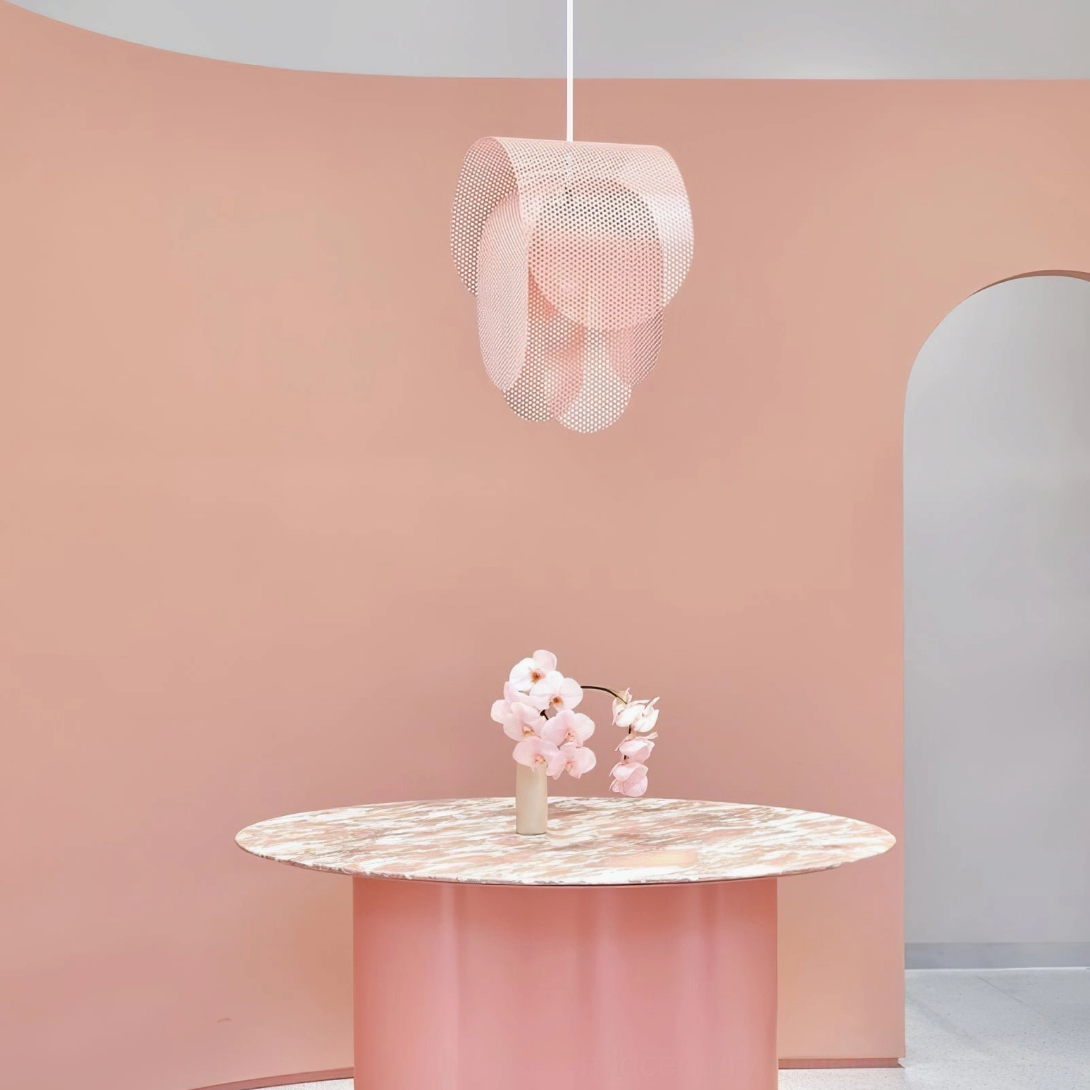 Posie pendant light in blush pink installed above dining table, soft pastel room setting