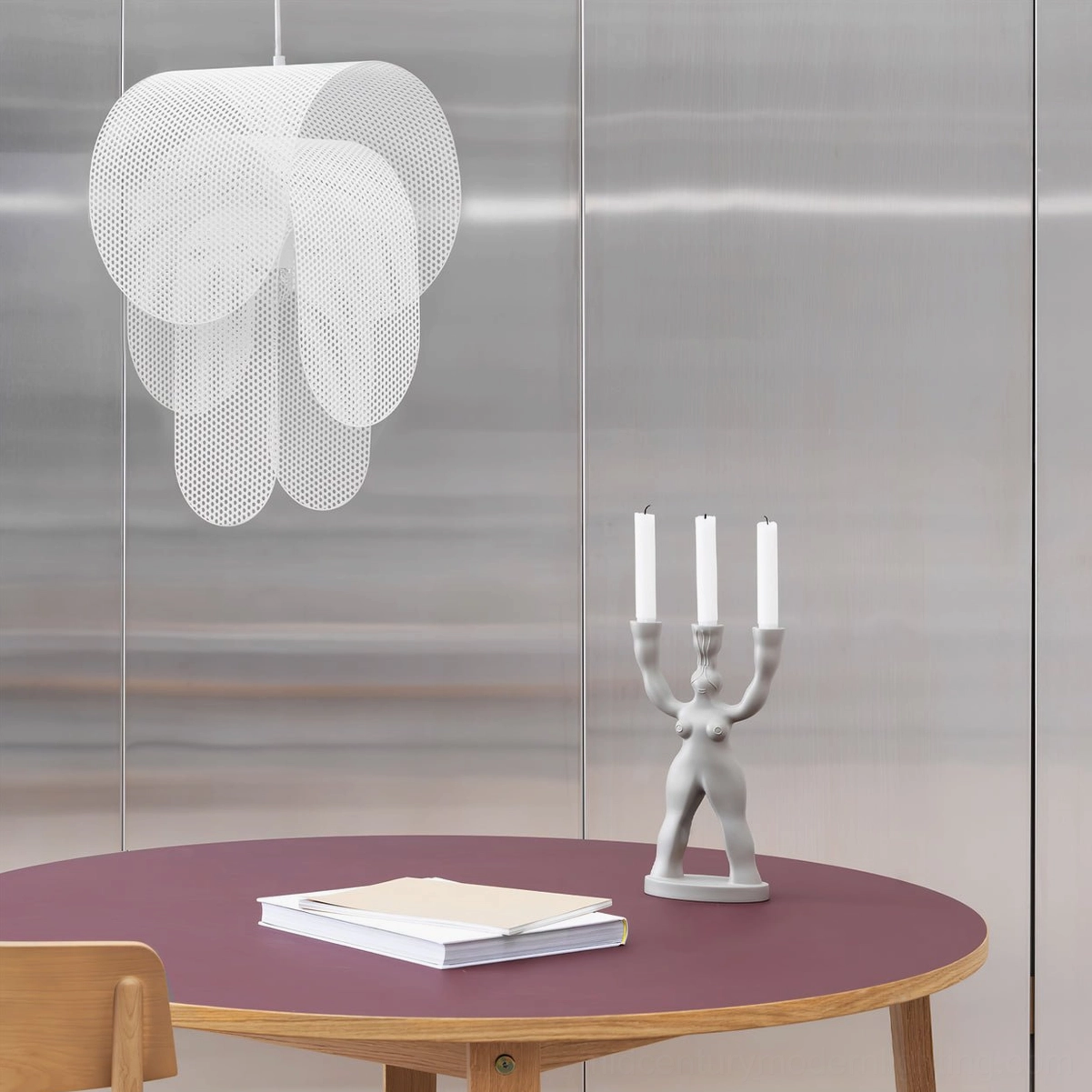 White Posie layered pendant light in contemporary interior with metallic accent walls