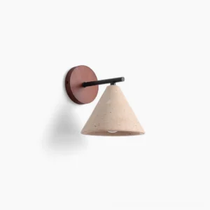 Possio travertine wall light with cone silhouette, showing porous stone texture and walnut wood accent against white studio background