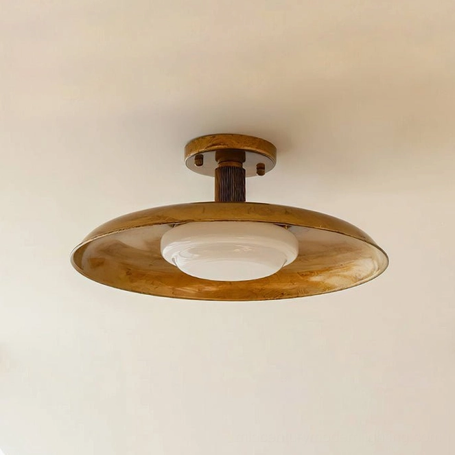 Vintage-inspired pot-lid ceiling fixture artistic lighting design and warm glow effect
