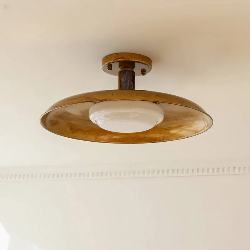 Dimensional perspective of flush-mounted pot-lid ceiling light showing compact profile and form