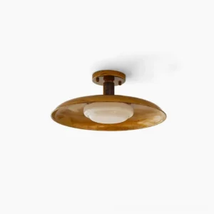 Vintage pot-lid flush mount ceiling light with antique brass finish and opal glass diffuser, studio product shot