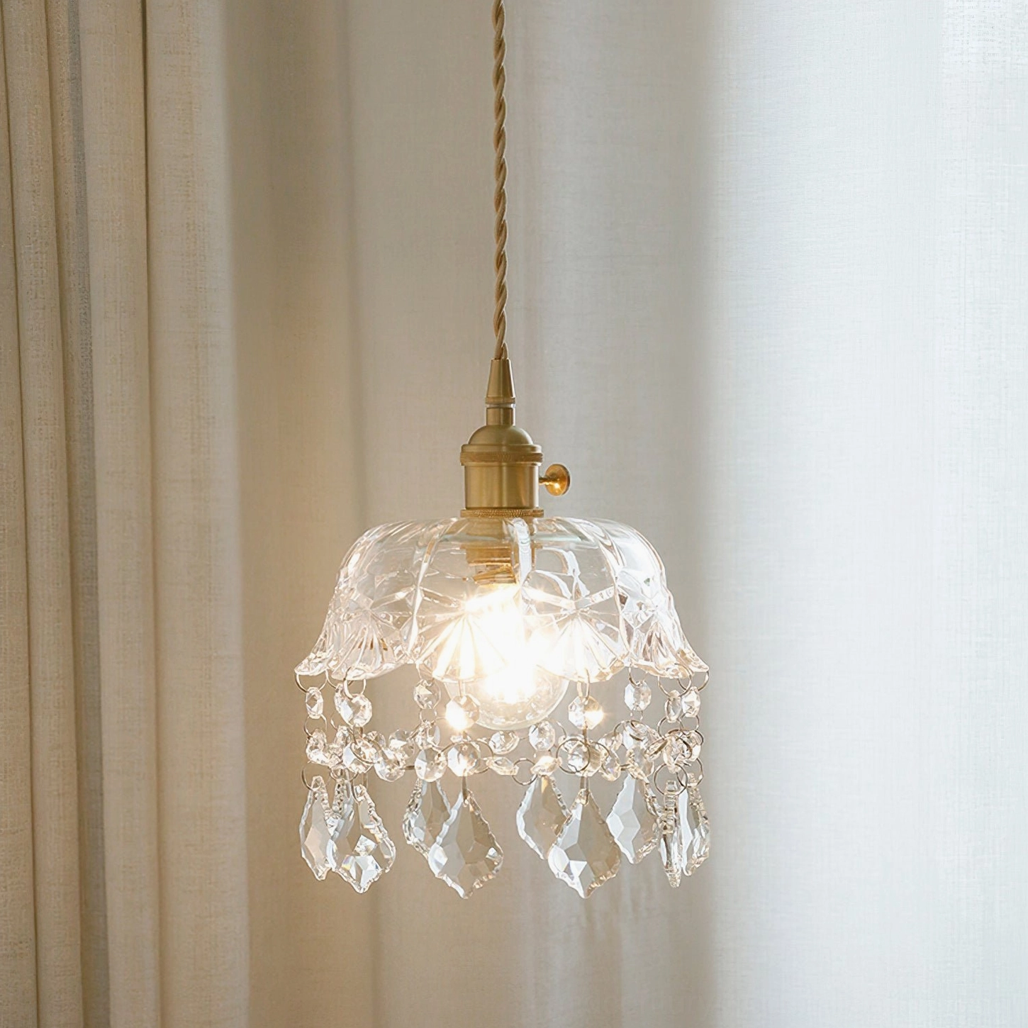 Pressed glass pendant light showing floral botanical pattern texture, artistic craftsmanship