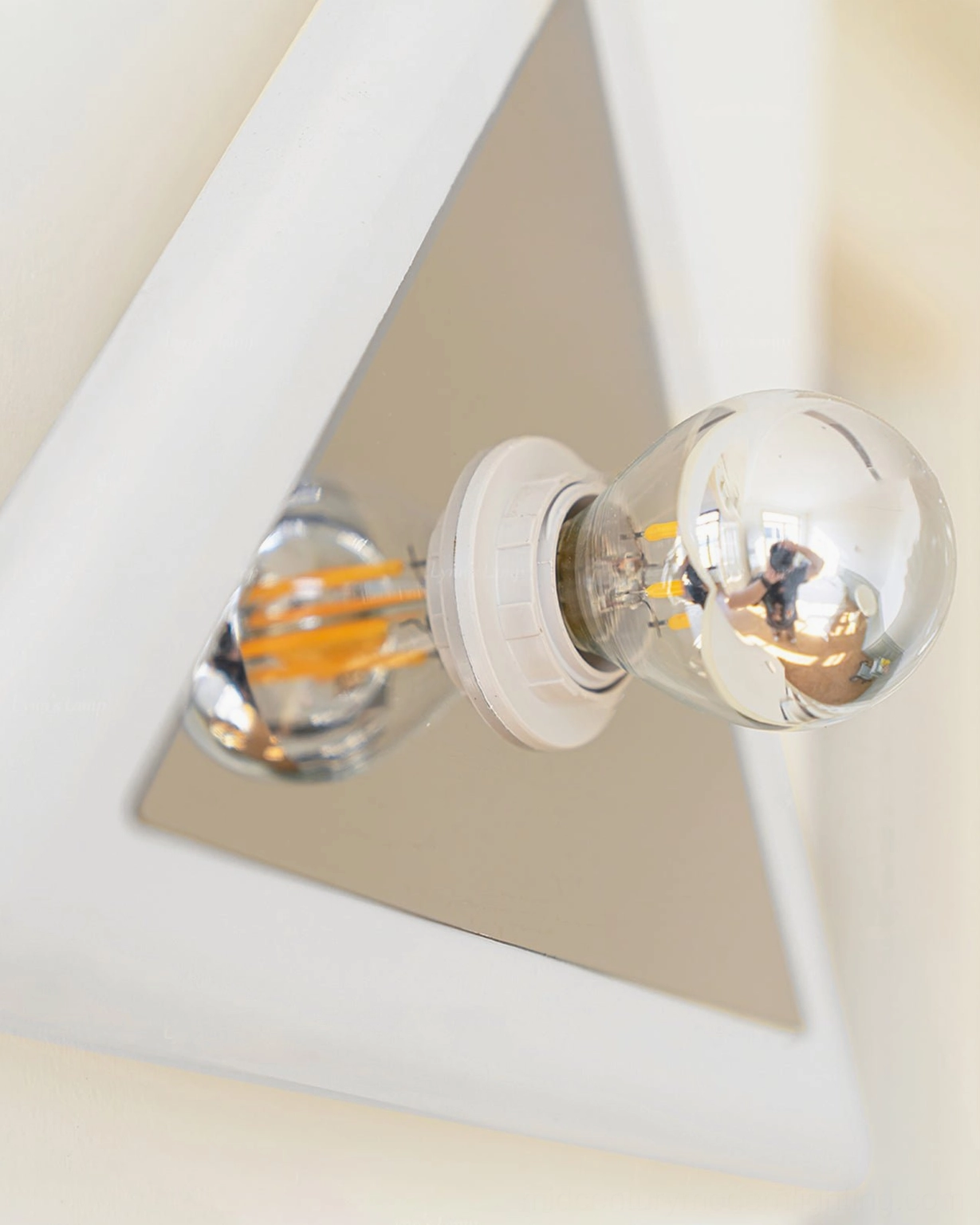 Prism triangle wall lamp close-up side dual filament bulbs geometric design