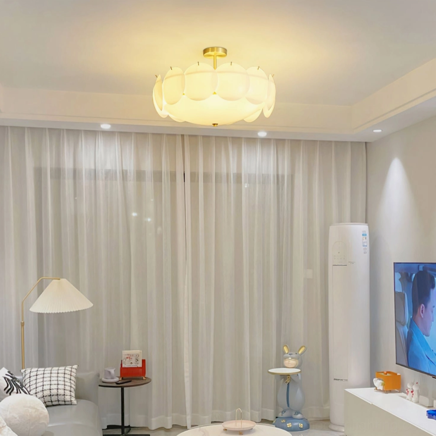 Prisma modern ceiling pendant in bright living room with ambient sheer curtains and minimalist design