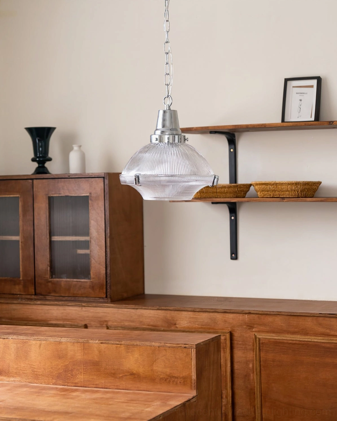 Hanging pendant lamp with clear ribbed glass shade in vintage dining room with wooden furniture
