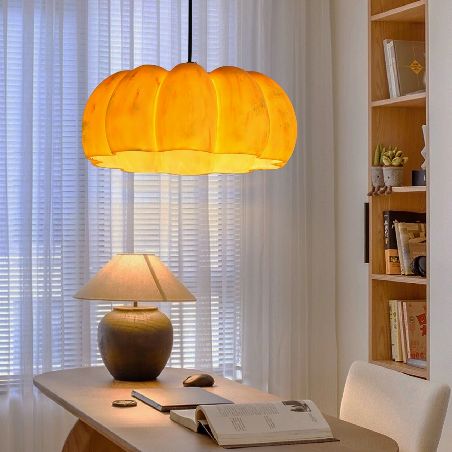 Pumpkin pendant lamp creating warm autumn aesthetic in eclectic home interior styling