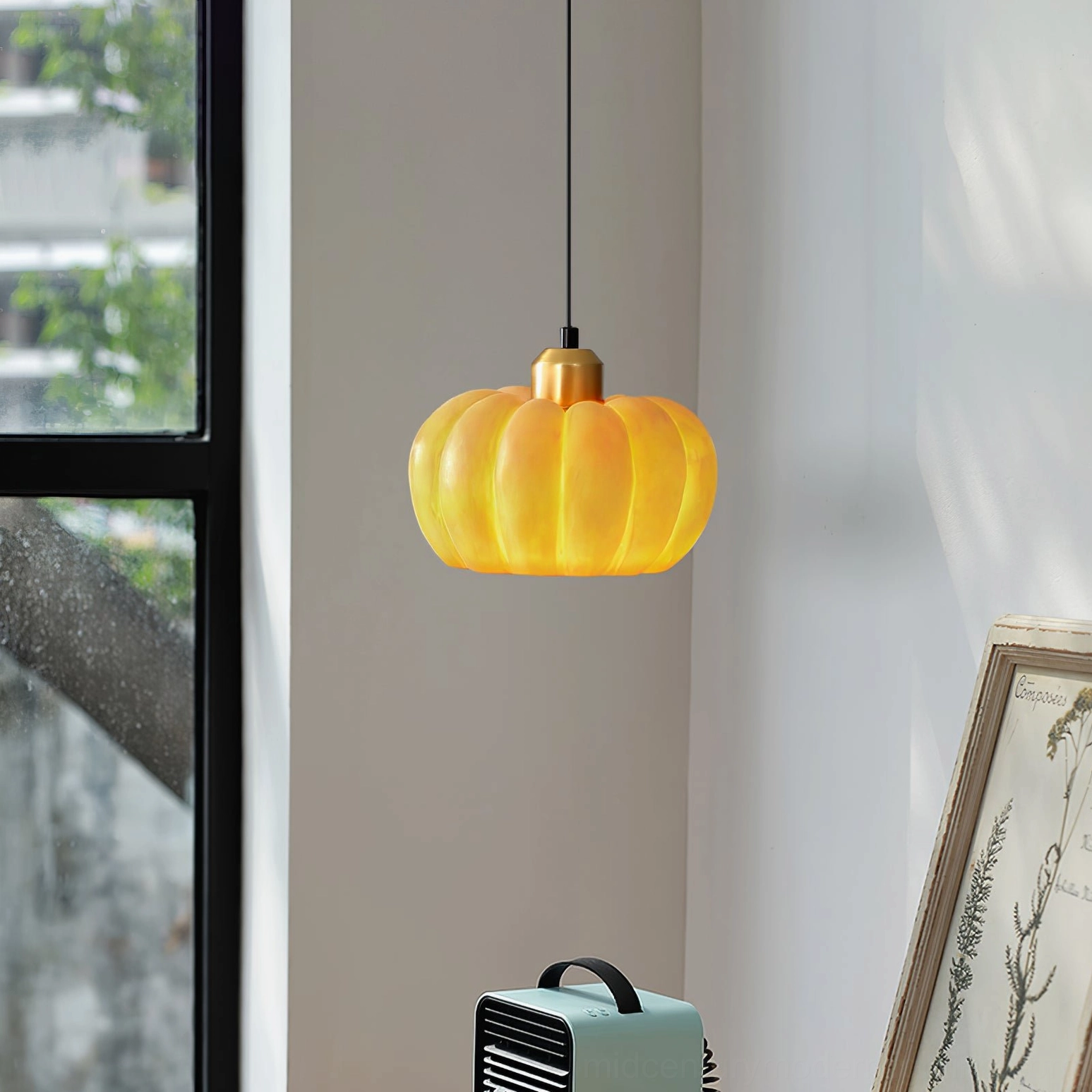 Pumpkin pendant lamp illuminated showing warm amber glow suitable for task and ambient lighting