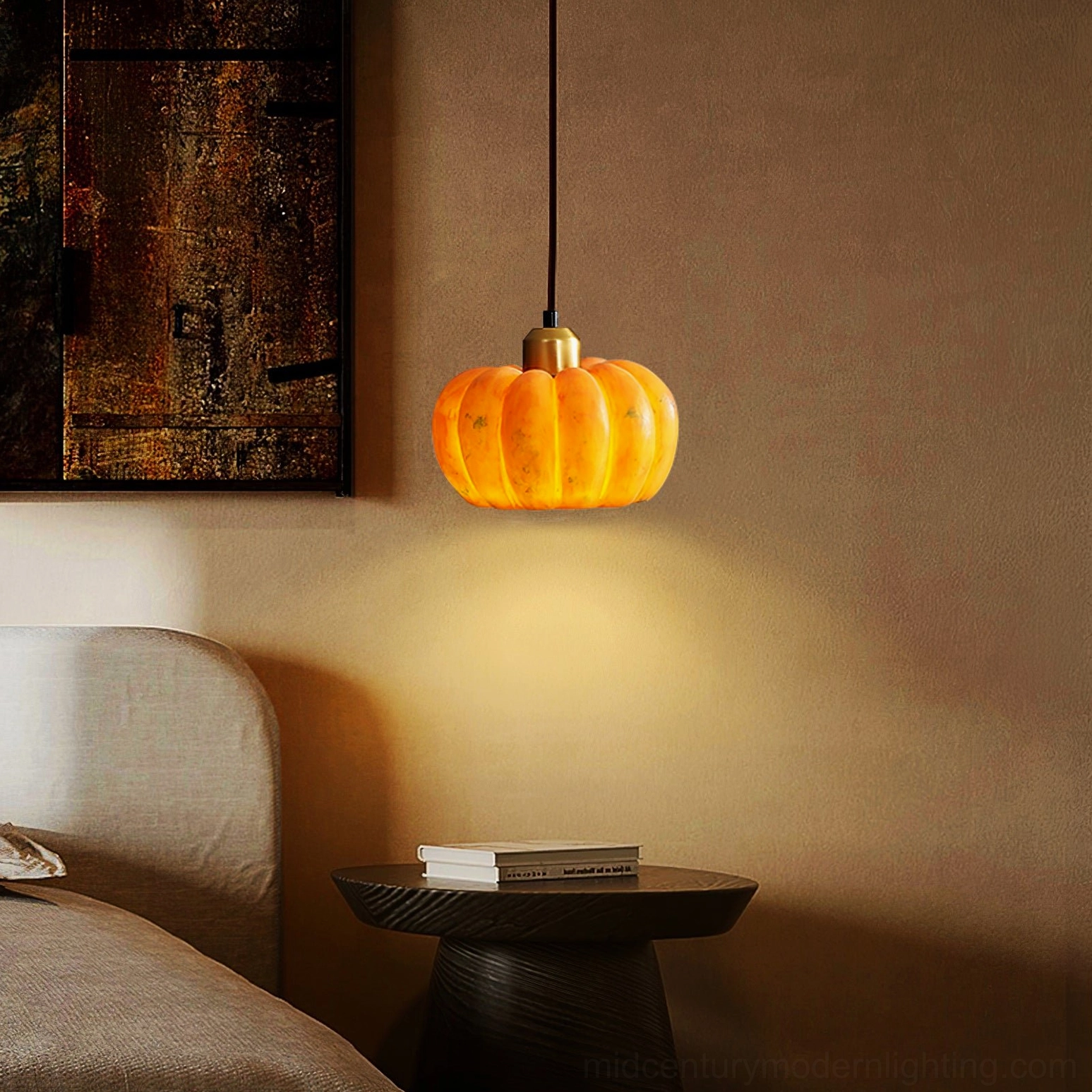 Pumpkin pendant lamp glowing warm light in minimalist bedroom bedside nook with wall art
