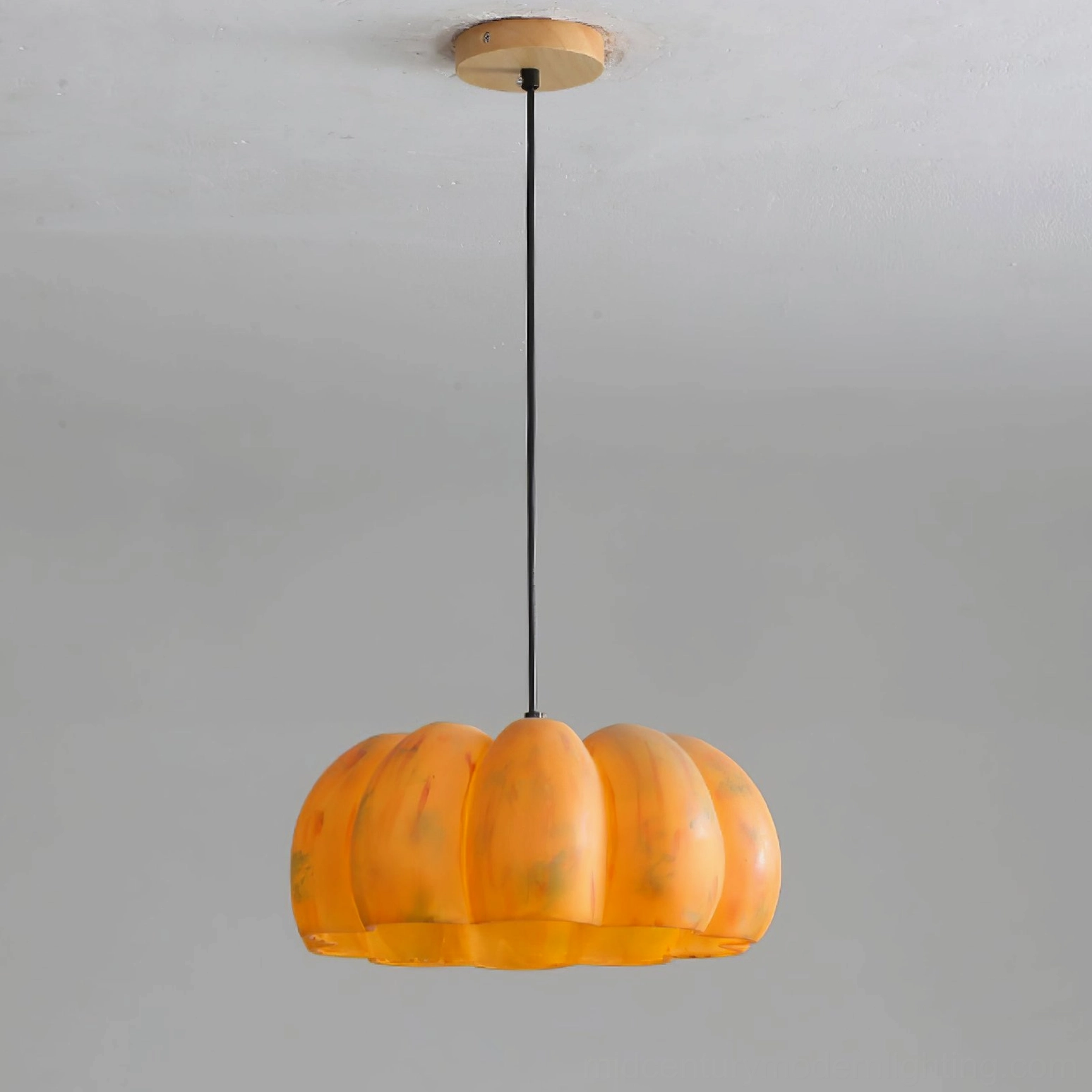 Small pumpkin pendant lamp proportions and warm amber tone in compact spaces
