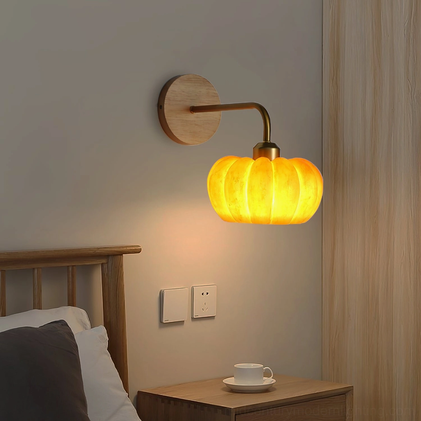 Pumpkin wall sconce mounted in bedroom beside nightstand, creating warm ambient light in Japanese-inspired minimalist bedroom decor