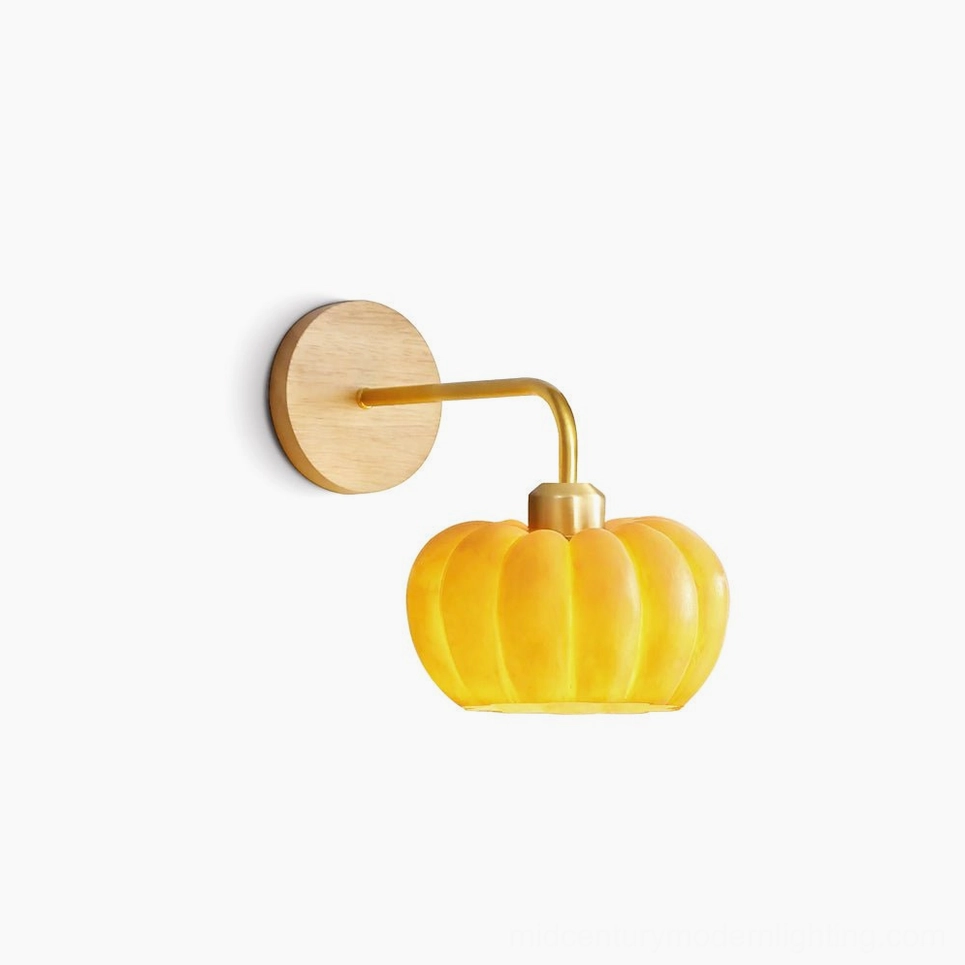 Pumpkin wall lamp in warm amber glass with metal and wood frame, studio product shot on neutral background showcasing mid-century modern design