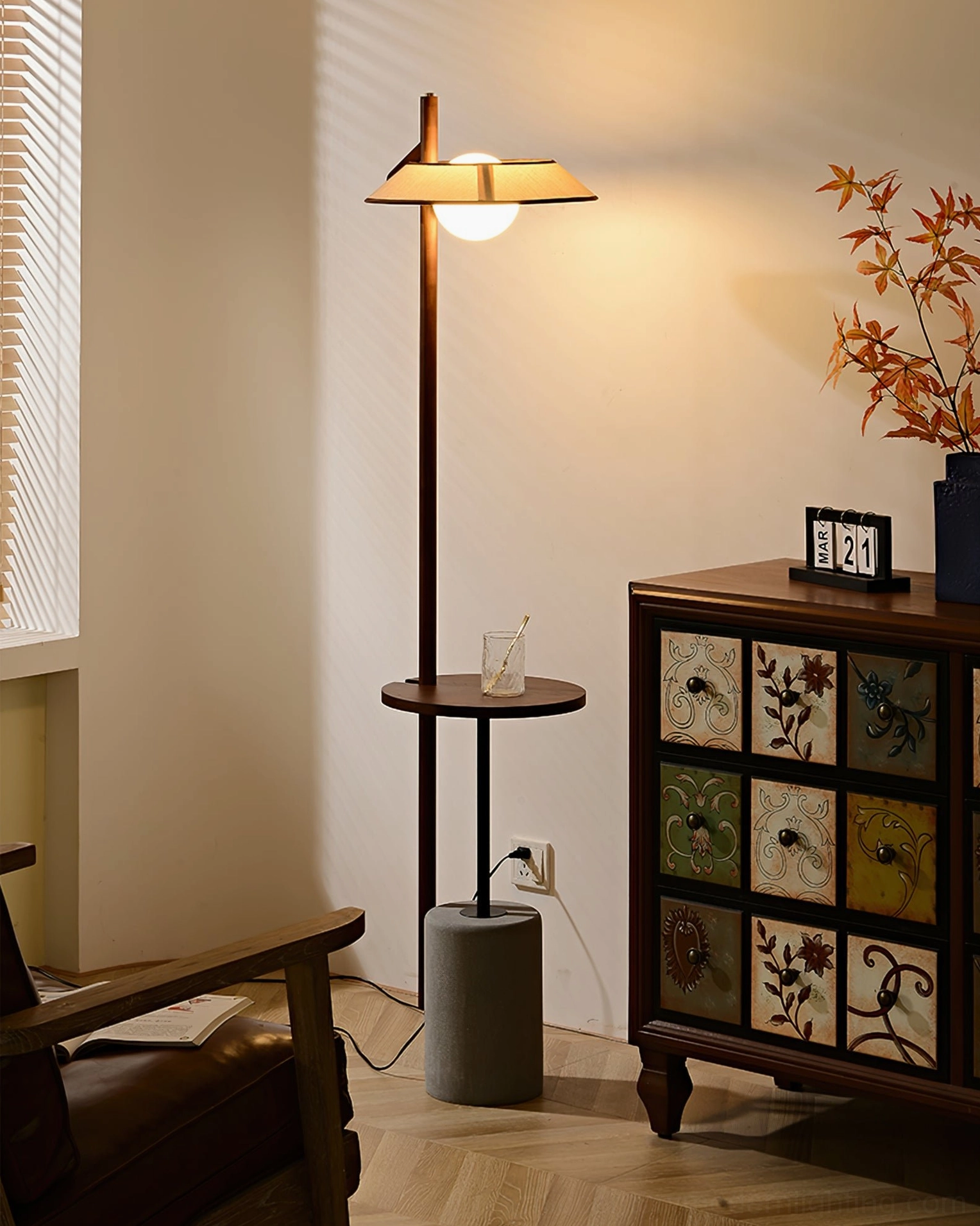 Puro floor lamp illuminated in modern bedroom corner creating ambient evening reading light