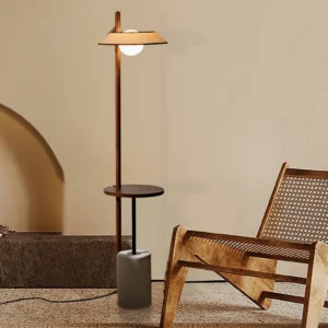 Puro floor lamp positioned beside rattan lounge chair in contemporary living room setting