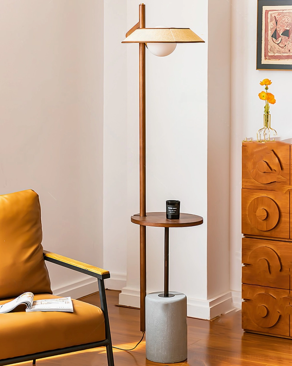 Puro floor lamp next to vintage leather armchair with wooden cabinet and yellow flowers