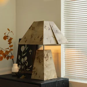 Mid-century modern pyramid wood lamp styled in vintage bedroom corner with dried flower arrangements, warm ambient lighting