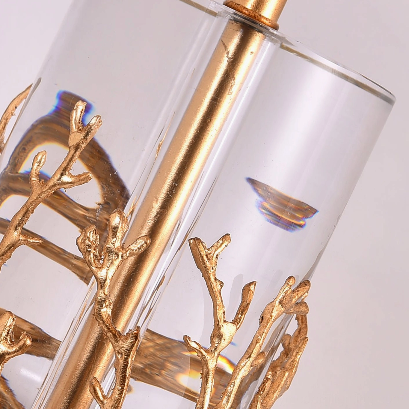 Quatrefoil table lamp complete view with white drum shade and decorative brass crystal base