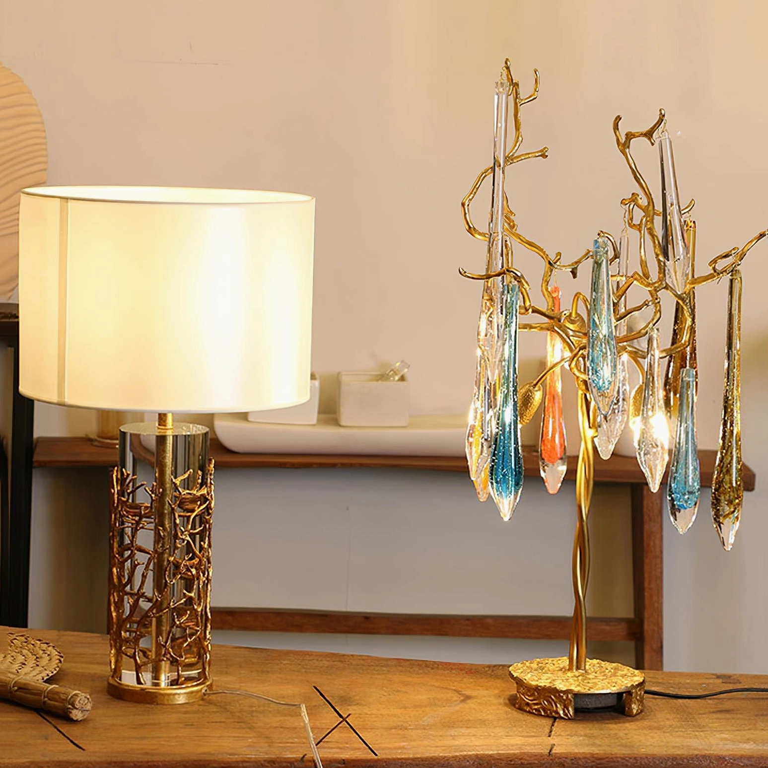 Quatrefoil table lamp paired with crystal drop decor light on wooden display table luxe styling