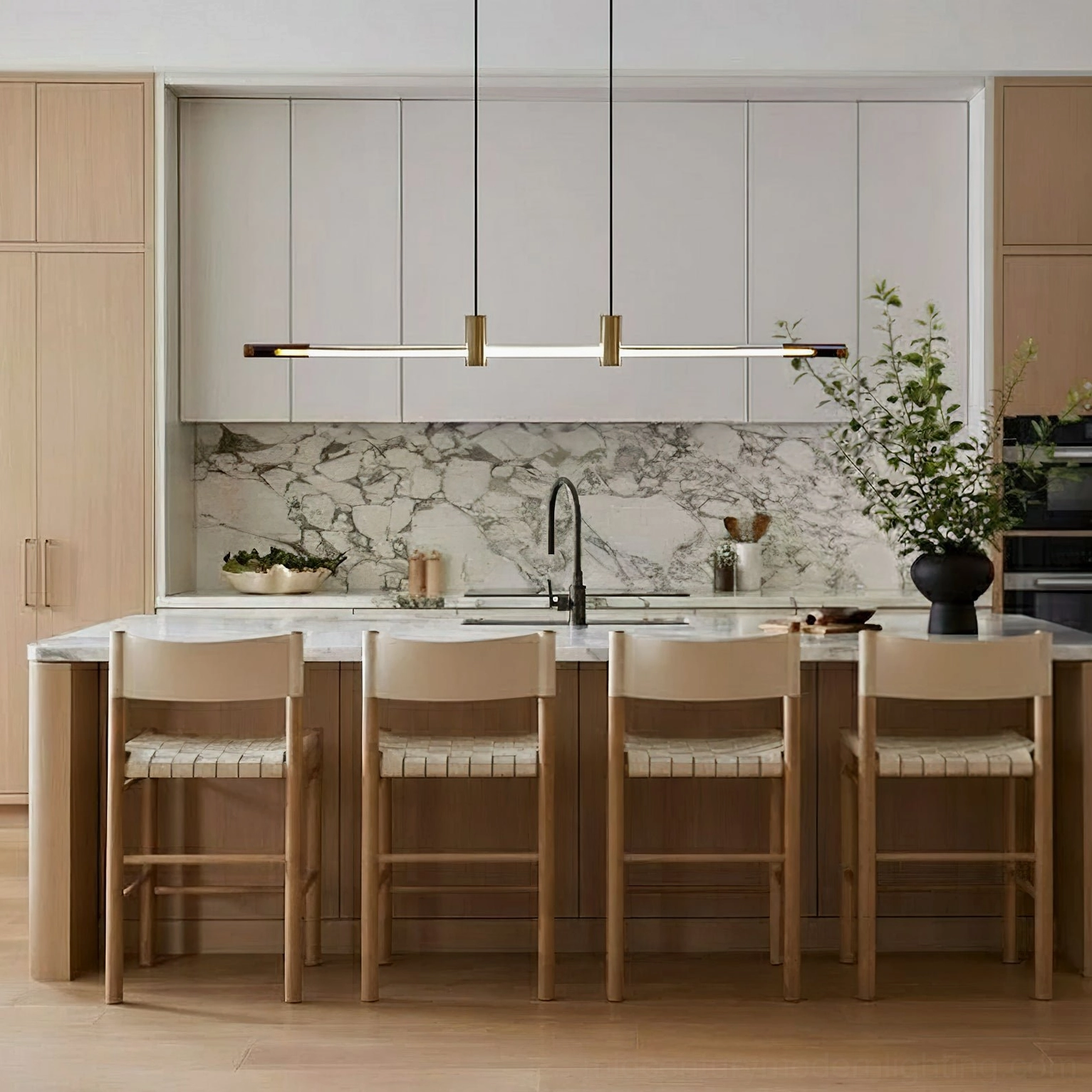 RA Linear Pendant Chandelier installed over modern kitchen island, warm minimalist lighting